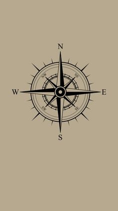 a black and white compass on a tan background with the word w is in it