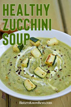 healthy zucchini soup in a white bowl on a wooden table