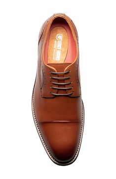 Broguing and burnished details accent a round cap toe lace-up that features anatomical arch support. Round cap toe Broguing details Lace-up Arch support removable insole Leather upper, manmade sole Imported Arch Support, Cognac, Derby, Men's Shoes, Leather Upper, Arch, Nordstrom, Lace Up, Lace