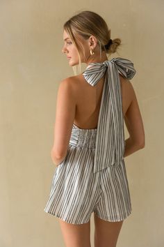 Straight from the Hamptons, the Solene Striped Linen Halter Romper is a beachy must-have for a fruitful Summer! This linen romper features a tie halter top, pinstripe pattern, and open back. Plus, it has pockets! Accessorize to complete the look!Details: Self: 100% Polyester Lining: 100% Polyester Double Lined Tie Halter Neckline Pockets Hand Wash Cold/ Lay Flat to Dry Tie Halter Top, Pinstripe Pattern, American Threads, Open Backs, Halter Romper, Linen Romper, Bogo Sale, Striped Linen, Halter Neckline