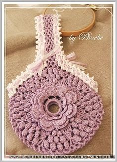 a crocheted bag with a flower on it