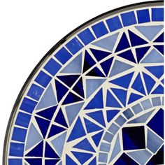 a blue and white plate with geometric designs on it