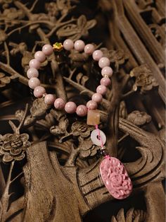 The "Eighteen-pieces Bead" (十八子手串) is a traditional Chinese accessory featuring eighteen beads, often made from materials like wood or stone. It is known for its symbolic significance and is used in various cultural and spiritual practices. The number eighteen is considered auspicious in Chinese culture, representing completeness and harmony. Traditional Pink Bracelets With Round Beads, Pink Agate Bracelets With 8mm Beads, Traditional Pink Beaded Bracelets Gift, Hand-strung Pink Agate Jewelry, Pink Hand-strung Agate Jewelry, Pink Agate Beaded Bracelets, Traditional Pink Beaded Bracelets With Round Beads, Pink Agate Spiritual Bracelets, Pink Spiritual Beaded Bracelet With Polished Beads