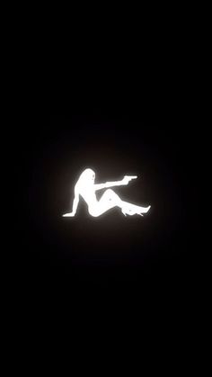 the silhouette of a woman is shown in the dark