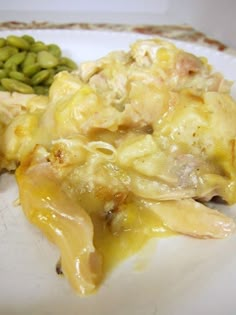 a white plate topped with green beans and chicken casserole next to broccoli