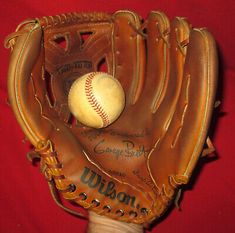 a baseball glove with a ball in it