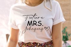 "Future Mrs Shirt, Custom Future Mrs Shirt, Bride Gift, Engagement Gift, Fiance Shirt, Bachelorette Party Shirt, Wedding Gift, Customize Tee, Custom Future Mrs Shirt, Bachelorette Party Shirt, Custom Bridal Gift, Engagement Gift, Fiance Shirt, Wedding Gift, New Mrs Shirt, Wifey Tee Team Bride Shirts, Bride Shirt, Bachelorette Party Shirts, Bridesmaid Shirts, Bridesmaid Proposal Gift, Bachelorette Shirts, Squad Shirt, Wifey and Hubby Shirt, Wedding Party Shirt, Honeymoon Shirt,Wedding Shirt,Wife and Hubs Shirts, Just Married Shirts, Matching Couple Shirt ----- About Us ----- All TeaShirtUS shirts use the highest quality material for ultra-soft and comfortable wear. Most importantly all of our shirts are printed using the most advanced apparel printer to ensure vibrant colors and detailed gr Spring Wedding Crew Neck Top, Fitted Short Sleeve Tops For Anniversary, Summer Cotton Tops For Anniversary, Cotton Tops For Summer Anniversary, Cotton Tops For Anniversary In Summer, Fitted Summer Tops For Bridal Shower, Fitted White Top For Bridal Shower, Fitted Crew Neck Top For Wedding, White Fitted Top For Bridal Shower