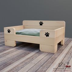 a wooden bed with paw prints on it