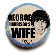 a button with the words george harrison's wife real on it