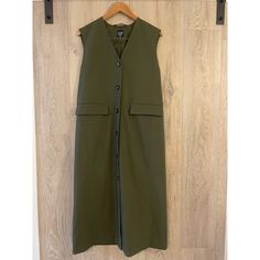 Details Long Oversized Tailored Vest Size Small Green 50% Cotton , 50% Polyester Gap Outerwear For Fall Layering, Green V-neck Outerwear For Work, Sleeveless Khaki Outerwear For Work, Gap Workwear Outerwear With Pockets, Oversized Tailoring, Tunic Vest, Tailored Vest, Global Work, Gap Jacket