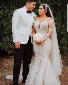 a bride and groom posing for a photo