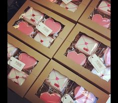 valentine's day cookies in boxes with tags on them