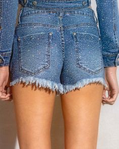 Enhance your wardrobe with these So Dramatic Rhinestone Denim Shorts. The mid rise cut offers a comfortable fit while the all over rhinestone detailing adds a touch of trendiness to your look. The distressed leg opening hem adds a touch of edge to your style. Perfect for any casual occasion. (S) Rise:9.5', Inseam: 3" Model is 5'5" and wearing a size small. Glamorous Straight Leg Denim Bottoms, Bedazzled Denim Bottoms, Denim Bottoms With Rhinestones For Night Out, Denim Rhinestone Bottoms For Night Out, Fitted Denim Bottoms With Rhinestones, Night Out Denim Bottoms With Rhinestones, Straight Leg Denim Bottoms With Sequins, Trendy Mid-rise Bottoms With Rhinestones, Straight Leg Denim Sequined Bottoms