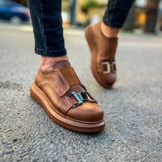 Introducing the "Miami Earthly Elegance." Dive deep into the rich allure of all brown, complemented by a seamlessly integrated undetachable belt. Crafted meticulously from the choicest vegan leather, these slip-ons are more than just a stylish statement but also promise Apollo's esteemed orthopedic cushioning. Key Features: All Brown Vegan Leather: Embodies pure sophistication. Undetachable Belt on Top: A touch of modern chic. Added Height: Elevating each step with an impressive 1.5 inches. Apol Orthopedic Shoes Stylish, Green Parka Coat, Chuck Taylor Shoes, Chic Belt, Green Parka, Shoes Stylish, Classy Outfits Men, Orthopedic Shoes, Mens Fashion Classy