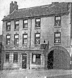 an old black and white photo of a building