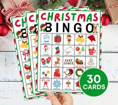 two christmas themed printables with the words christmas bingo and 30 cards in front of them