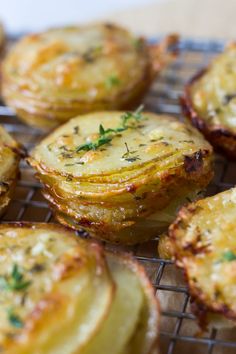 some food is sitting on a wire rack and ready to be cooked in the oven