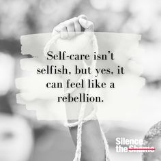 someone holding up a sign that says self - care isn't selfish, but yes it can feel like a rebellion