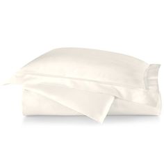 the white sheets and pillow cases are folded up on top of each other in front of a white background