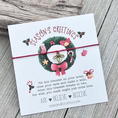 a greeting card with a christmas wreath on it