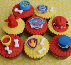 some cupcakes are decorated with cartoon characters