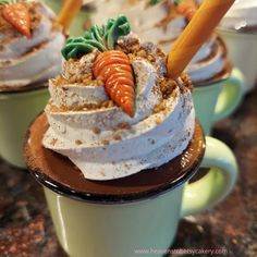 carrots are on top of whipped cream in small cups