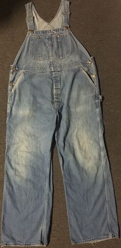 Vintage 60s 70s Union Made Faded Distressed denim overalls in blue in sz. 40/29. Various spotting/fading/repairs/wear as pictured. Union Made in the USA. No size tag, see measurements for reference. See pictures for condition/wear. ******PLEASE MAKE SURE YOU READ AND UNDERSTAND THESE GUIDELINES****** ALL SALES FINAL so understand what you are purchasing. The pictures in this listing and the description are all part of the item description so make sure you have examined all measurements, photos, Vintage Washed Blue Bottoms For Fall, Spring Retro Distressed Jeans, Retro Washed Bottoms For Streetwear, Retro Distressed Jeans For Fall, Vintage Streetwear Bottoms For Spring, Vintage Jeans For Fall Streetwear, Vintage Jeans For Fall, Vintage Distressed Bottoms For Fall, Retro Distressed Bottoms For Streetwear