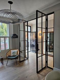 a living room filled with furniture and windows