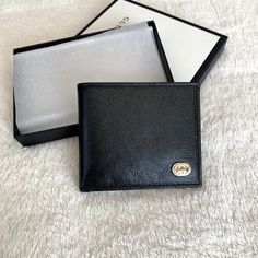 Very Unique Bifold Men’s Wallet From Gucci Featuring Glass Finish Leather And Brand Plaquet Logo Luxe Calf Leather W/ Smooth Finish Classic Black Front Plaquet Logo With Silver/Gold Details Bifold Closure 8 Individual Card Slots 2 Bill Compartments 2 Side Slots Gucci Rectangular Wallet With Rfid Blocking, Luxury Bifold Wallets For Business, Luxury Bifold Business Wallets, Designer Gucci Wallet With Logo Plaque, Designer Gucci Wallet With Rfid Blocking, Gucci Luxury Wallet With Rfid Blocking, Gucci Luxury Wallets With Rfid Blocking, Gucci Leather Wallet With Rfid Blocking, Gucci Leather Wallets With Rfid Blocking