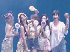 the girls are all holding lollipops in their hands