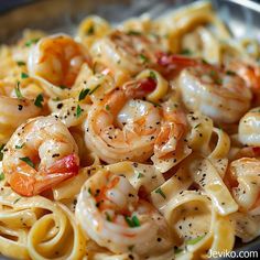 pasta with shrimp and tomato sauce in a bowl