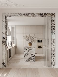 a white and black marble kitchen with an oven in the back ground, sink on the right