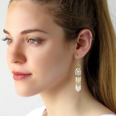 "I created this bead tassel earring by hand, using gold plated brass castings, Swarovski Rivoli 8mm, Swarovski beads-3mm, Miyuki Delica beads, Miyuki round seed beads, and 14k goldfilled fringe and ear-wire * Measurements: Earring length: 2.75\" (7cm) Earring width: 0.40\" (1cm) * The earrings will come beautifully packaged for a gift. * For other Bridal earrings: https://www.etsy.com/ca/shop/LioraBJewelry?ref=listing-shop2-all-items-count%C2%A7ion_id&section_id=16552834 * my shop: https://w Beaded Wedding Earrings, Bohemian Wedding Jewelry, Long Turquoise Earrings, Swarovski Crystal Drop Earrings, Crystal Teardrop Earrings, Long Gold Earrings, Prom Earrings, Turquoise Earrings Dangle, Beaded Tassel Earrings