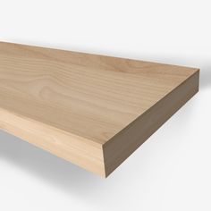 a close up of a wooden shelf on a white background