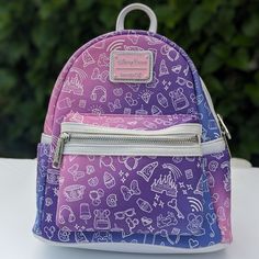 New Without Tags. My Kid Decided Disney Style And Pink Stuff Is Not For Her Anymore And Never Used The Bag . In Excellent Condition Simulated Leather Mini Backpack 80% Pvc / 20% Polyurethane Approx. 10 1/2'' H X 8 3/4'' X 4 3/4'' Double Zipper Main Compartment Front Zip Pocket Loungefly Logo Metal Pulls Side Slip Pockets Top Carry Handle Padded Shoulder Straps Silver Tone Hardware *Disney Merch Collectors *Mini Backpack Themed Purple Travel Bags, Disney Purple Travel Backpack, Purple Disney Bags For Back To School, Disney Purple Bags For Back To School, Disney Purple Backpack, Purple Disney Backpack, Disney Purple Back To School Bag, Purple Backpack For Disney Trips, Loungefly Mini Backpack