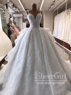 a white wedding dress on display in a store