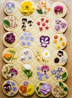 the cookies are decorated with edible flowers and have been cut into smaller circles to make them look like they were made out of dough