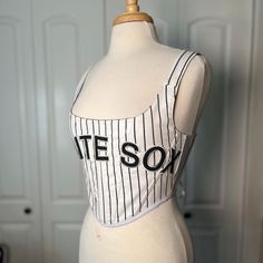 Over-bust corset with flexible boning and silk ribbon closure.  Made from a Chicago White Sox pinstripe cotton jersey. Fits a small  - US 2-6 (sizing is pretty flexible due to the lace up closure) Mannequin's measurements - Waist: 27" Bust: 37" Let me know if you have any questions. Jersey Corset, White Sox Jersey, Jersey Fits, Corset Lingerie, White Sock, Chicago White Sox, Silk Ribbon, Corsets, Favorite Outfit