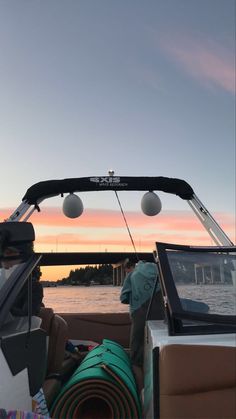 the back end of a boat at sunset