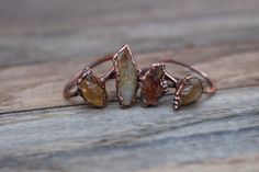 Raw Citrine Ring, Crystal Stackable Rings, Electroformed Jewelry ------------------------------------------ :: D E T A I L S :: This listing is for one handmade ring with a raw Citrine crystal. These are unique and look great with any outfit! Please select the size you would like from the drop-down menu. These unique rings were created through a process known as electroforming, or growing copper onto an object using positive and negative currents. Copper amplifies the energies of all crystals/st Copper Electroformed Jewelry, Copper Electroforming, How To Wear Rings, Raw Citrine, Raw Gemstone Jewelry, Raw Stone Ring, Raw Crystal Jewelry, Ring Crystal, Tiny Rings