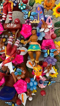 many colorful figurines are stacked on top of each other