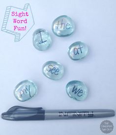 six buttons with the words sight word fun written on them next to a piece of paper