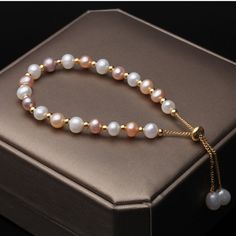 This beautiful Freshwater pearl bracelet ranges between 7-8mm in size and consists of beautiful and lustrous pearls in AAAA+ quality. All pearls in this bracelet are round and are strung with silk thread and double-knotted between each pearl. Known as the 'icon' of cultured pearls, Freshwater pearls have graced the necks, ears, fingers, and wrists of women for decades. Huge Tomato imports their Freshwater pearls from the Freshwater rs of Japan, grown in the Pinctada fucata oyster. All of our Fre Adjustable Luxury Pearl Bracelet, Luxury Adjustable Round Pearl Bracelet, Elegant Gold Pearl Bracelet With 8mm Beads, Elegant Adjustable Hand-strung Pearl Necklace, High Luster Pearl Bracelet Gift, Elegant Pearl Bracelet With 8mm Beads, Elegant Rose Gold Beaded Bracelets With 8mm Beads, Elegant Rose Gold Pearl Bracelet With Round Beads, Gift Pearl Bracelet With High Luster