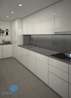 an empty kitchen with white cabinets and counter tops