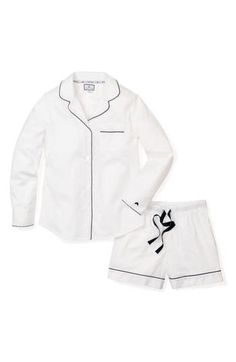 This refined pajama set is polished off with smooth contrast piping, elegantly curved lapels and a chest patch pocket. Top has curved lapels; long sleeves 100% cotton Machine wash, dry flat Imported Classic Fitted Sleepwear For Loungewear, Classic White Sleepwear For Pajama Party, Classic White Long Sleeve Sleepwear, Navy Blue Pajamas, Luxury Sleepwear, Classic Pajamas, Cotton Pjs, Contrast Piping, Short Pajama Set