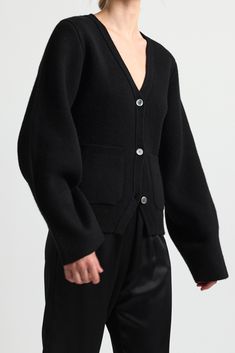 A mid to heavy weight wool cardigan with wide sleeves and a deep v neck. Front button closure and patch pockets for a chic look. It's like an outerwear piece for the transitional colder months. Contemporary Wardrobe, V Neck Cardigan, Chic Look, Wide Sleeves, Wool Cardigan, Deep V Neck, Deep V, Heavy Weight, Jewelry Sales