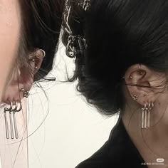 two people with ear piercings on their ears