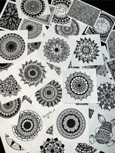 several black and white designs on paper