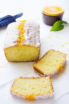 slices of lemon pound cake with icing and orange zest