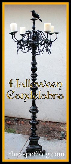 a black candelabra with three candles on it